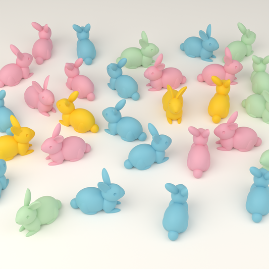 A scatter of pastel 3D-printed hunt bunnies in pink, blue, yellow and mint