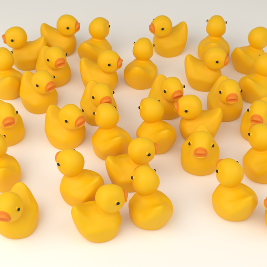 A pile of small yellow numbered hunt ducks ready to hide for a party