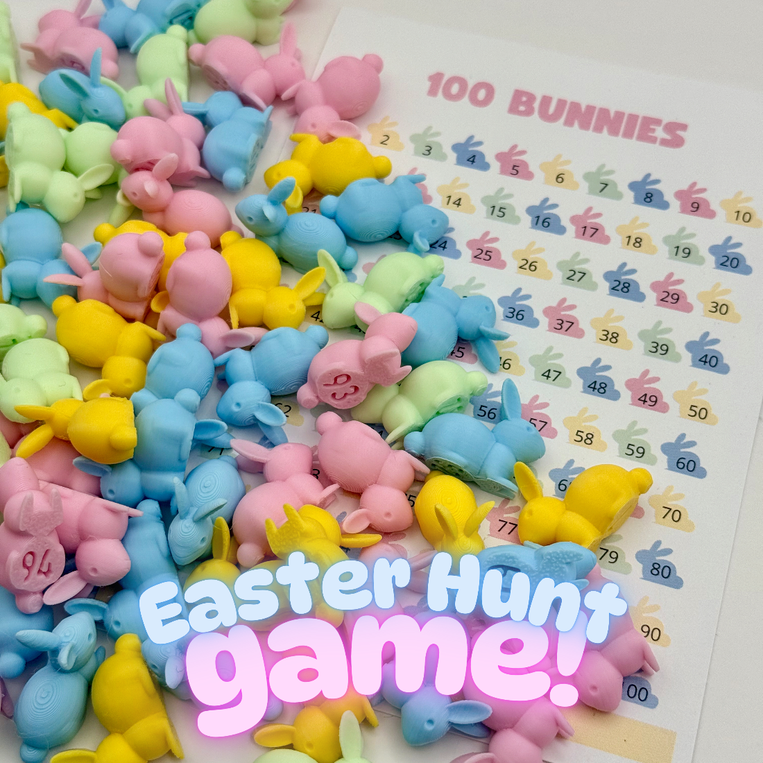 100 pastel-colored numbered bunnies spread out next to a tracking sheet with bunny illustrations